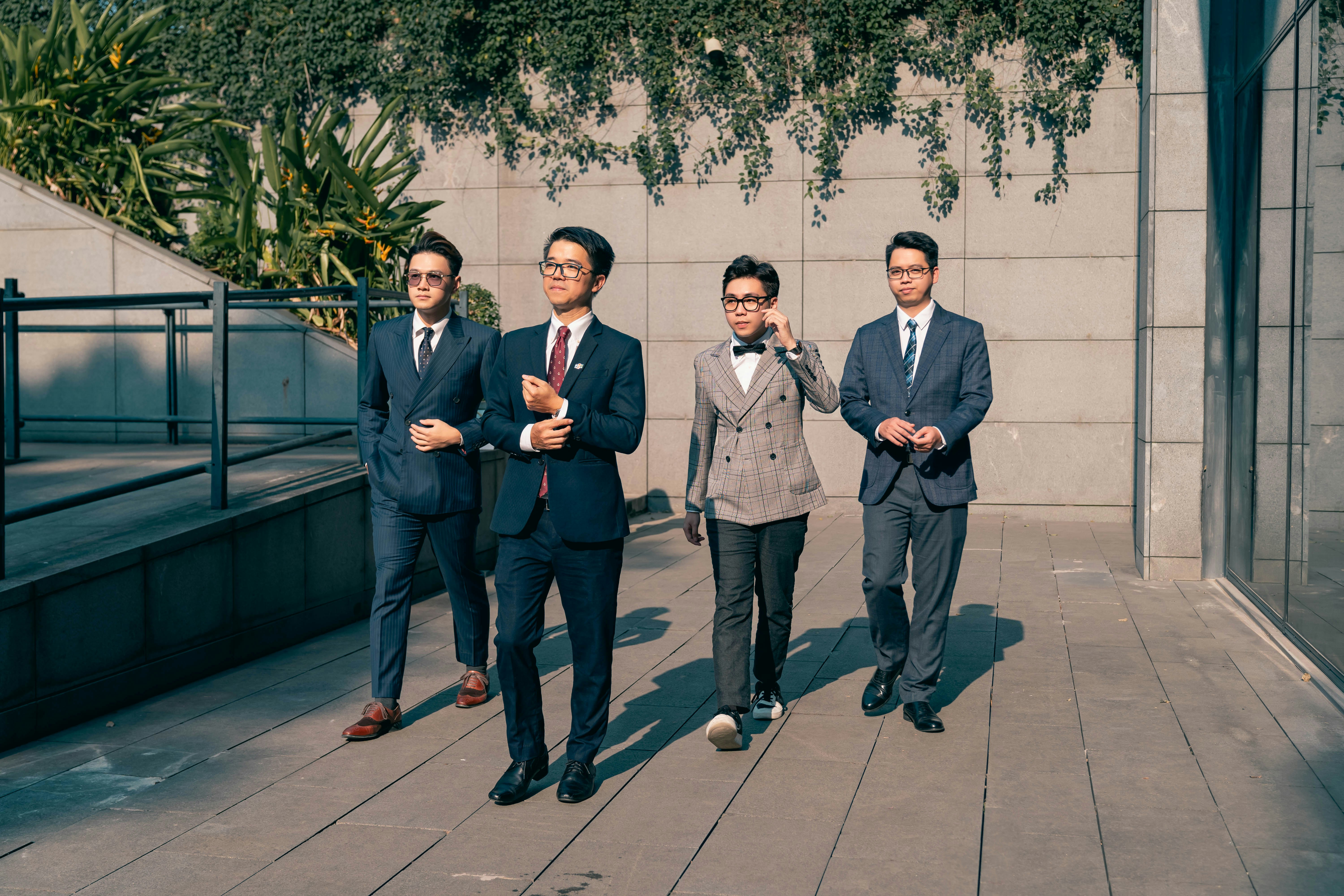 4 guys chilling in suits cause they're not gay
